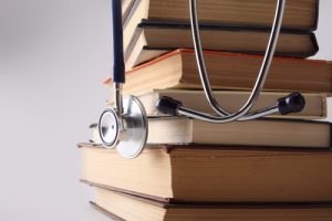 Stethoscope on pile of books