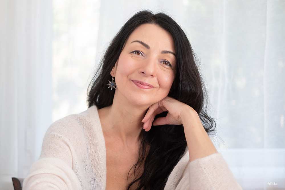 Mature woman with long dark hair